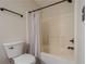 Bright bathroom features a soaking tub with shower and neutral-toned walls at 2055 Summer View Place Sw, Marietta, GA 30060