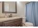 Stylish bathroom featuring a granite vanity and shower with curtain at 2055 Summer View Place Sw, Marietta, GA 30060
