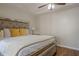 Comfortable bedroom with wood floors, tray ceiling, and ceiling fan at 2055 Summer View Place Sw, Marietta, GA 30060