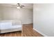 Bedroom with wood-look floors, tray ceiling, fan and lots of wall space at 2055 Summer View Place Sw, Marietta, GA 30060