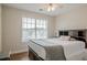 Inviting bedroom with large window, ceiling fan and wood-look floors at 2055 Summer View Place Sw, Marietta, GA 30060
