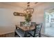 Cozy dining area featuring stylish lighting, dark wood table, and easy access to outdoor patio at 2055 Summer View Place Sw, Marietta, GA 30060