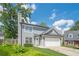 Charming two-story home with a well-manicured lawn, and an attached two-car garage at 2055 Summer View Place Sw, Marietta, GA 30060