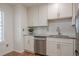 Bright kitchen featuring stainless steel appliances, white cabinetry, and granite countertops at 2055 Summer View Place Sw, Marietta, GA 30060