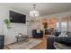 Inviting living room with a fireplace, chandelier, and an open floor plan at 2055 Summer View Place Sw, Marietta, GA 30060