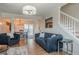 Inviting living room with a fireplace, dining room, and staircase at 2055 Summer View Place Sw, Marietta, GA 30060