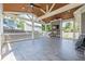 Spacious covered patio with ceiling fans, TV, and tiled flooring, great for entertaining at 2055 Summer View Place Sw, Marietta, GA 30060