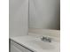 Updated bathroom featuring a white sink vanity with chrome faucet and a large mirror at 5634 Windwood Rd, Atlanta, GA 30349