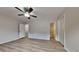 Spacious main bedroom features a ceiling fan, neutral walls, and wood-look laminate flooring at 5634 Windwood Rd, Atlanta, GA 30349