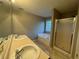 Bathroom featuring double sinks, soaking tub, a separate shower, and a window at 851 Walkingstick Dr, Douglasville, GA 30134