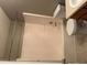 Standard bathroom featuring a combination shower unit and toilet with an adjacent sink at 851 Walkingstick Dr, Douglasville, GA 30134
