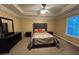 Bedroom with carpet, neutral walls, ceiling fan, and a comfortable bed with stylish bedding at 851 Walkingstick Dr, Douglasville, GA 30134