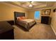 Bedroom with carpet, neutral walls, ceiling fan, and a comfortable bed with stylish bedding at 851 Walkingstick Dr, Douglasville, GA 30134