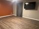 Bedroom featuring wood floors, neutral paint, curtains and a ceiling fan with a wall mounted television at 851 Walkingstick Dr, Douglasville, GA 30134