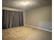 Carpeted bedroom featuring curtains, neutral paint and a ceiling light at 851 Walkingstick Dr, Douglasville, GA 30134