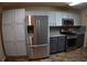 Well-equipped kitchen featuring stainless steel appliances, ample cabinet space, and modern finishes at 851 Walkingstick Dr, Douglasville, GA 30134