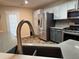 Updated kitchen with stainless steel appliances, granite countertops, and shaker style cabinets at 851 Walkingstick Dr, Douglasville, GA 30134