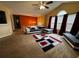 Bright living room featuring modern furniture, vaulted ceiling, and large windows with stylish curtains at 851 Walkingstick Dr, Douglasville, GA 30134