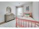 Charming bedroom featuring bright decor, a patterned rug, and natural light at 231 Ivey Ter, Temple, GA 30179