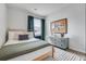 Cozy bedroom with a comfortable bed, stylish dresser, and natural light at 231 Ivey Ter, Temple, GA 30179