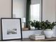 Close-up of decor featuring a framed print, flowers, and decorative objects at 231 Ivey Ter, Temple, GA 30179