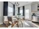 Eat-in kitchen dining area with modern lighting, stainless steel appliances and neutral palette at 231 Ivey Ter, Temple, GA 30179