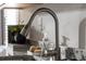 Close-up of kitchen sink with stainless steel faucet and granite countertops at 231 Ivey Ter, Temple, GA 30179