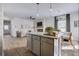 Open-concept living area features a spacious layout, hardwood floors, a fireplace, and large windows at 231 Ivey Ter, Temple, GA 30179