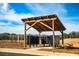 Community mailboxes under a covered wooden structure on a sunny day at 231 Ivey Ter, Temple, GA 30179