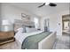 Relaxing primary bedroom boasts soft, neutral colors, plush bedding, and an ensuite bathroom at 231 Ivey Ter, Temple, GA 30179