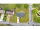 An aerial view of a charming home with a well-maintained lawn, mature trees, and a peaceful neighborhood setting at 2586 Abbotts Glen Nw Dr, Acworth, GA 30101