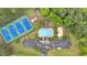 Overhead view of community amenities including tennis courts, a swimming pool, and landscaped surroundings at 2586 Abbotts Glen Nw Dr, Acworth, GA 30101