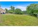 Spacious backyard with a privacy fence and mature trees, offering ample space for outdoor activities at 2586 Abbotts Glen Nw Dr, Acworth, GA 30101