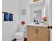 Charming half bathroom featuring stylish vanity, modern fixtures, and elegant decor at 2586 Abbotts Glen Nw Dr, Acworth, GA 30101