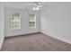 Bedroom featuring two windows and neutral carpet at 2586 Abbotts Glen Nw Dr, Acworth, GA 30101
