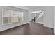 Spacious entryway featuring hardwood floors and staircase with black handrail at 2586 Abbotts Glen Nw Dr, Acworth, GA 30101