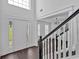 Grand foyer with a staircase, large windows, and modern flooring and an open floor plan at 2586 Abbotts Glen Nw Dr, Acworth, GA 30101