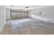 Spacious garage with concrete floor, garage door, and entry door at 2586 Abbotts Glen Nw Dr, Acworth, GA 30101