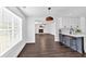 Bright, open-concept kitchen features a breakfast bar with seating and modern white cabinets at 2586 Abbotts Glen Nw Dr, Acworth, GA 30101