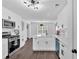 Bright kitchen with stainless steel appliances, white cabinets, modern countertops and hardwood floors at 2586 Abbotts Glen Nw Dr, Acworth, GA 30101