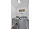 Laundry area with modern gray washer and dryer, wire shelving, and decor sign at 2586 Abbotts Glen Nw Dr, Acworth, GA 30101