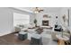 Cozy living room featuring a fireplace, ceiling fan, and plenty of seating at 2586 Abbotts Glen Nw Dr, Acworth, GA 30101