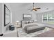 Main bedroom with ceiling fan, carpet and neutral decor at 2586 Abbotts Glen Nw Dr, Acworth, GA 30101