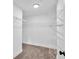 Walk-in closet with multiple levels of white wire shelving for ample storage at 2586 Abbotts Glen Nw Dr, Acworth, GA 30101