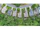 Serene aerial view of homes nestled in a green community with mature trees and gardens at 4445 Vanadium Bend, Cumming, GA 30040