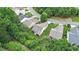 Beautiful aerial view highlighting the property's setting amidst lush greenery and manicured lawns at 4445 Vanadium Bend, Cumming, GA 30040