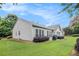 Lush backyard with a well-manicured lawn and comfortable patio, ideal for outdoor relaxation at 4445 Vanadium Bend, Cumming, GA 30040