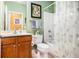 Well-lit bathroom with neutral decor and a shower-tub combination at 4445 Vanadium Bend, Cumming, GA 30040