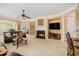 Bright living room featuring a fireplace and open access to other living areas at 4445 Vanadium Bend, Cumming, GA 30040