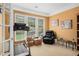 Bright office features a treadmill, comfortable seating, and sun-filled windows at 4445 Vanadium Bend, Cumming, GA 30040
